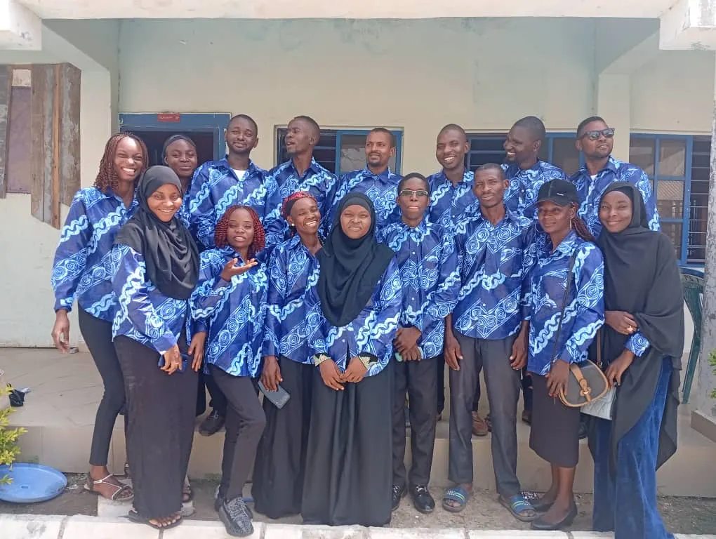 Teachers guiding students in a classroom